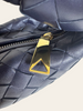 Bottega Veneta Mini Jodie Space Nappa Intrecciato — detail: close-up of the gold triangular zipper pull against the woven leather.