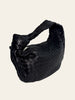 Bottega Veneta Small Jodie Black Intrecciato — angled view showing the knotted handle and slouchy silhouette.