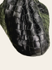 Bottega Veneta Small Jodie Black Intrecciato — detail: close-up of the woven texture at a corner/edge.