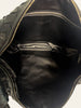 Bottega Veneta Small Jodie Black Intrecciato — interior view: The embossed Bottega Veneta stamp.