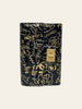 Chanel Calfskin Crocodile Embossed Graffiti 2.55 Reissue Flap Card Holder Black Gold — side profile view showing the crossover flap silhouette.