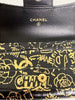 Chanel Calfskin Crocodile Embossed Graffiti 2.55 Reissue Flap Card Holder Black Gold — interior view: the flap open, showing the 'CHANEL' stamp and gold snap stud.