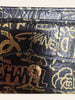 Chanel Calfskin Crocodile Embossed Graffiti 2.55 Reissue Flap Card Holder Black Gold — detail: extreme close-up of the crocodile-embossed graffiti texture and snap stud.