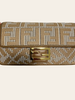 Fendi Wool Houndstooth FF Baguette Beige — detail: close straight-on view of the flap and gold FF baguette clasp detail.