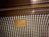 Fendi Wool Houndstooth FF Baguette Beige — interior view: close-up of the interior zip pocket and houndstooth fabric lining, with a woven 'Baguette Fendi' tag.