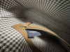 Fendi Wool Houndstooth FF Baguette Beige — interior view: close-up of the zip pocket, houndstooth lining, and a woven 'Fendi Roma' label.