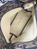 Goyard Bohème Mini Hobo Navy Goyardine — interior view: Beige/natural canvas lining and navy chevron trim at the edges, silver zipper pull visible.