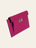Hermès Kelly Pocket Compact Wallet Rose Pourpre Epsom — three-quarter angled view showing the compact silhouette and turn-lock closure.