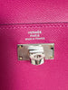 Hermès Kelly Pocket Compact Wallet Rose Pourpre Epsom — detail: close-up of the 'HERMÈS PARIS MADE IN FRANCE' stamp embossed above the turn-lock.