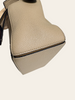 Loewe Small Puzzle Sand Calfskin — detail: close-up of one side panel and the top zipper corner.
