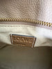 Loewe Small Puzzle Sand Calfskin — detail: interior close-up of the embossed 'LOEWE, Made in Spain' leather label.